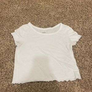White crop top with a small stain.